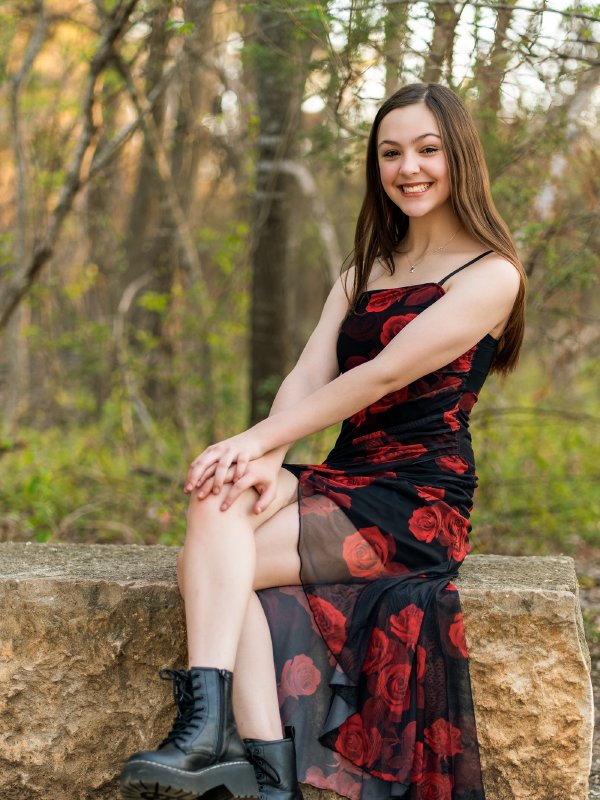 Golden hour senior portrait of Hailey in a Frisco park