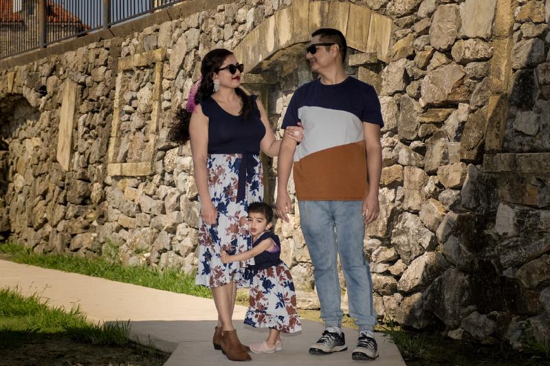 Family walking together at Adriatica Village during a portrait session