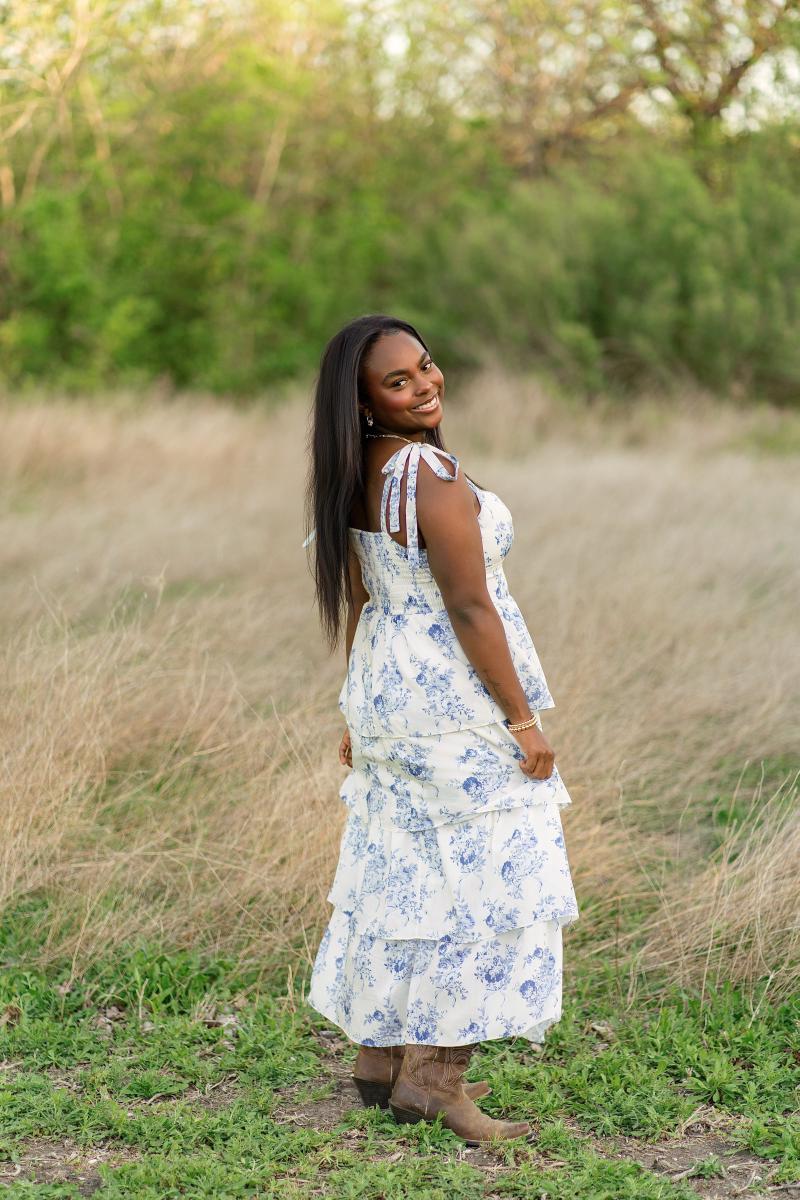 Golden hour senior portrait of Zoe at Limestone Quarry Park in Frisco
