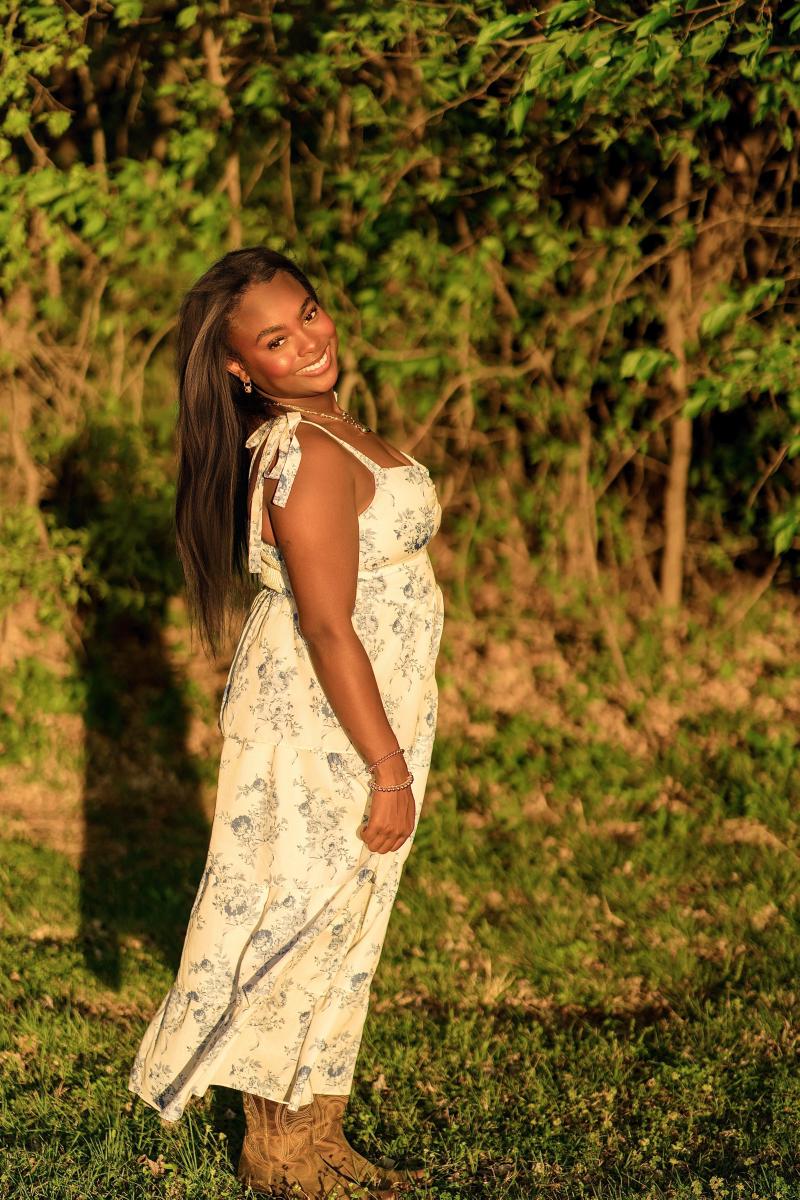 Senior portrait of Zoe at golden hour in a Frisco park