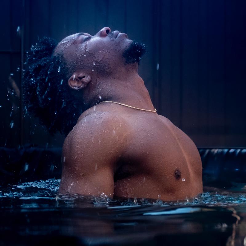Dramatic underwater pose emerging from the water