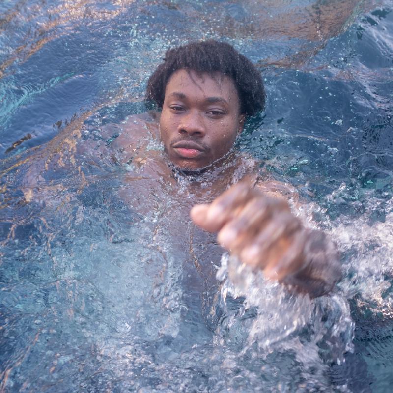 Underwater portrait with professional lighting in a private pool